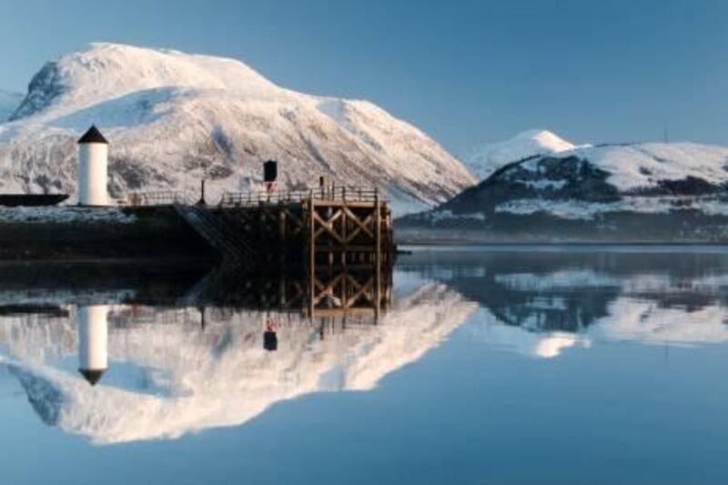 Loch Eil, Highland, Scotland. Corpach Lighthouse on Loch Eil with Ben Nevis and Fort William in the background. (Photolibrary.com)