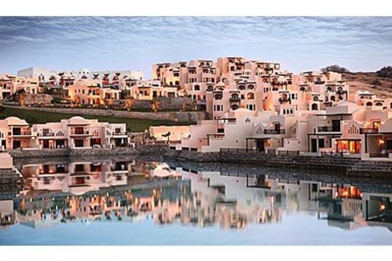 Villas with small private pools overlook the lagoon.