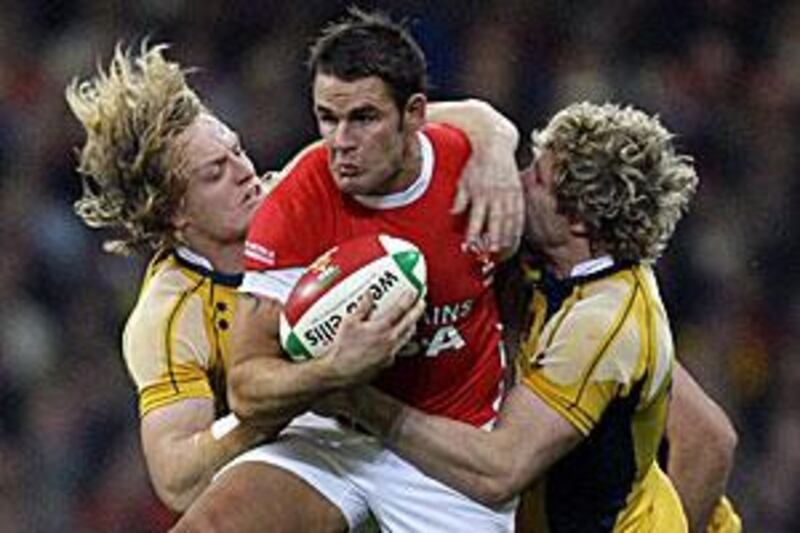 Lee Byrne, centre, hopes he can reclaim the No 15 jersey for Wales when he returns from injury.