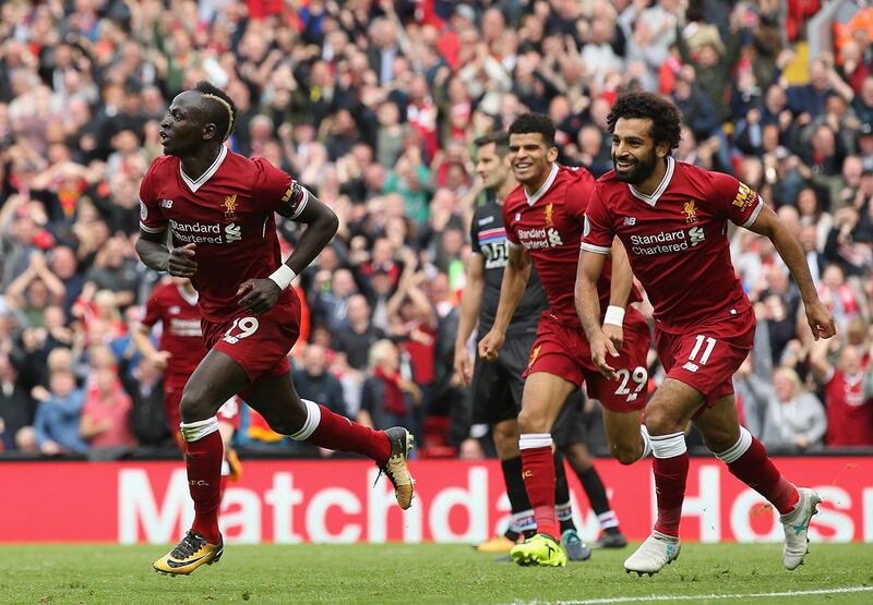 LIVERPOOL, ENGLAND - AUGUST 19: Sadio Mane of Liverpool celebrates scoring his sides first goal with his Liverpool team mates during the Premier League match between Liverpool and Crystal Palace at Anfield on August 19, 2017 in Liverpool, England.  (Photo by Jan Kruger/Getty Images)