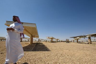 A Saudi man stands at a solar plant in Uyayna, north of Riyadh. Green hydrogen is extracted from water using renewable energy such as wind, hydropower and solar energy, which is in abundance in the Gulf. AFP