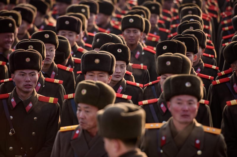 Korean People's Army soldiers gather. North Koreans marked the 77th anniversary of the birth of their former leader Kim Jong Il on Saturday. AFP