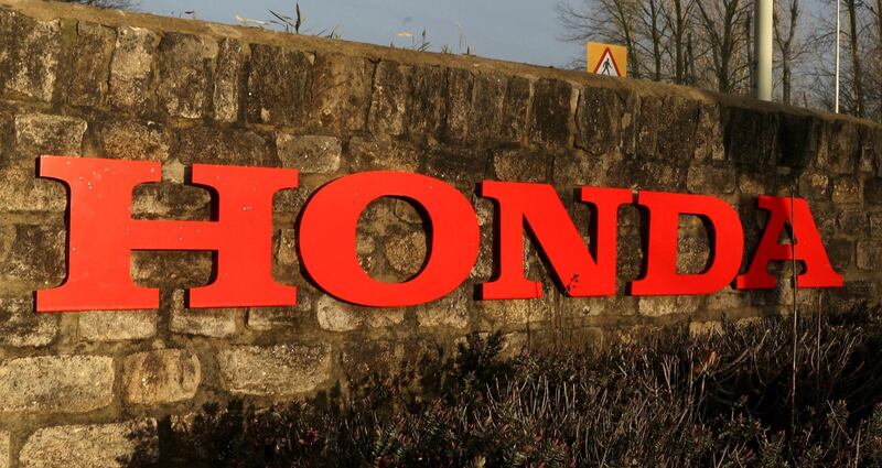 A general view of a sign outside the Honda car plant in Swindon, western England, Monday Feb. 18, 2019.  The Japanese carmaker Honda will close a car factory in western England with the potential loss of some 3,500 jobs, according to media reports Monday and confirmed by local lawmaker Justin Tomlinson.  (Steve Parsons/PA via AP)
