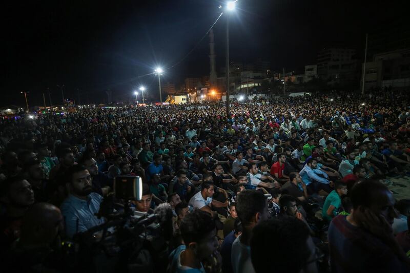 Palestinians football supporters watch a public screening of the 2019 Africa Cup of Nations in Gaza City.  EPA