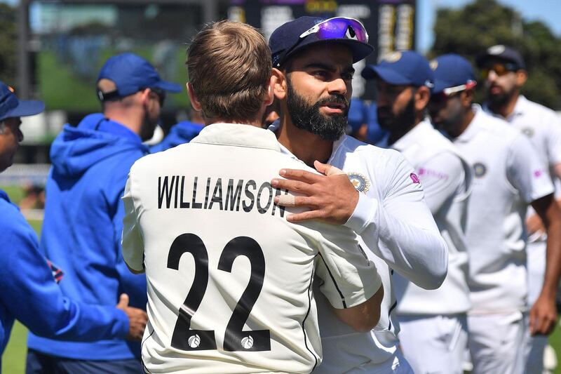 New Zealand's captain Kane Williamson (L) hugs India's captain Virat Kohli after New Zealand's win. AFP