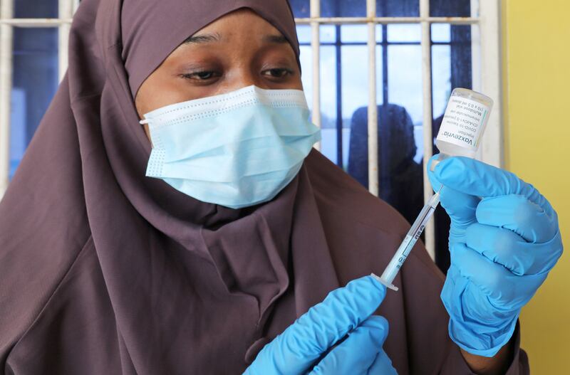 A healthcare worker prepares to administer a Covid-19 vaccine in Mogadishu, Somalia. Reuters