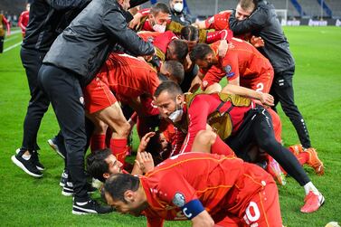 North Macedonia players celebrate after their winning goal against Germany. EPA