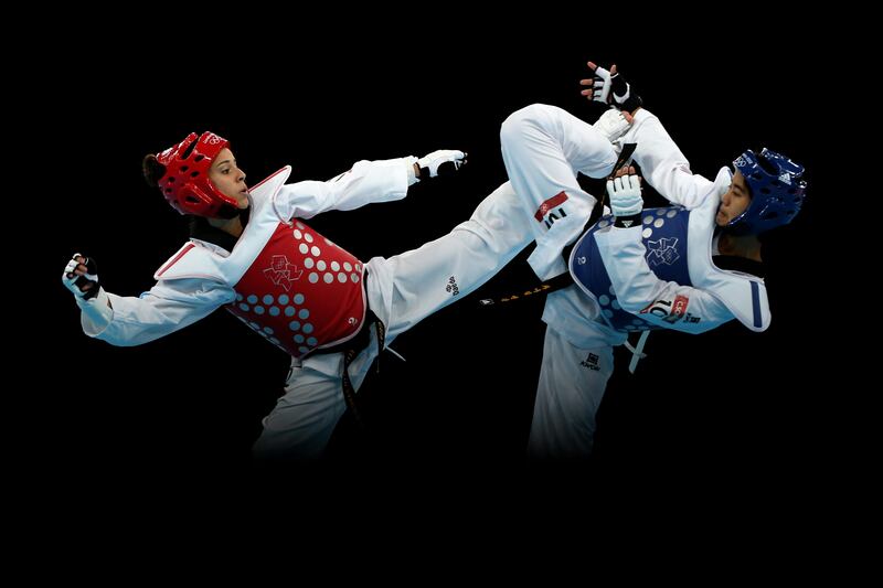 LONDON, ENGLAND - AUGUST 08:  Chanatip Sonkham (R) of Thailand competes against Elizabeth Zamora Gordillo of Guatemala during the Women's -49kg Taekwondo bronze medal match on Day 12 of the London 2012 Olympic Games at ExCeL on August 8, 2012 in London, England.  (Photo by Hannah Johnston/Getty Images)