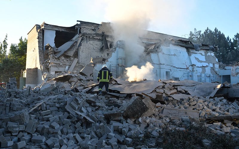 Rescuers working on a residential building partially destroyed by missile strike in Bashtanka, Mykolaiv as the Russian war in Ukraine continues. AFP