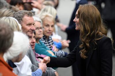 Princess Kate shakes hands and speaks to members of the public. AFP