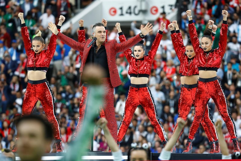 Robbie Williams performs during the opening ceremony. Kai Pfaffenbach / Reuters