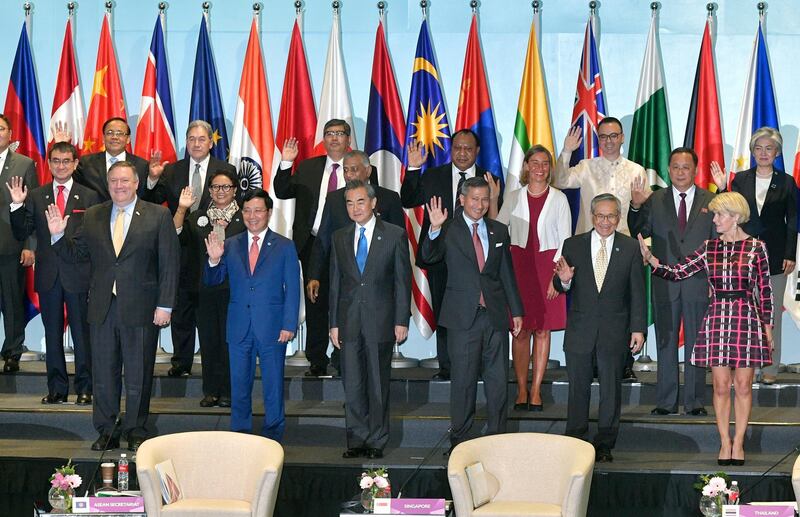 Representatives attending the 25th ASEAN Regional Forum Retreat pose for a group photograph in Singapore, Saturday, Aug. 4, 2018. (AP Photo/Joseph Nair)