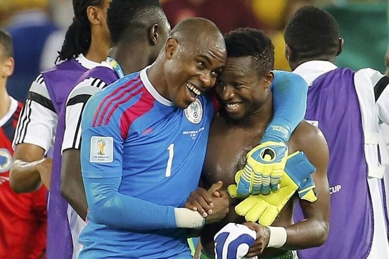 Nigeria's Vincent Enyeama, left, celebrates with Ogenyi Onazi after a win over Bosnia at the 2014 World Cup in Brazil. Eric Gaillard / Reuters