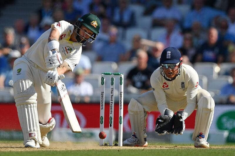 Australia's Matthew Wade plays a shot as England wicketkeeper Jonny Bairstow watches on. AFP