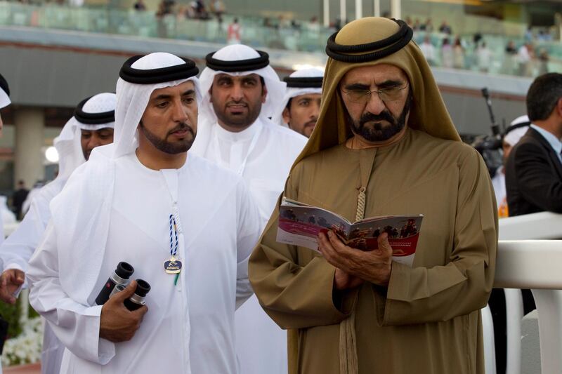 Dubai, United Arab Emirates - March 30 2013 -  Sheikh Mohammed bin Rashid Al Maktoum, Prime Minister of the UAE reads a racecard prior to the Dubai Gold Cup race at the Meydan Racecourse at the annual Dubai World Cup. (Razan Alzayani / The National)  
