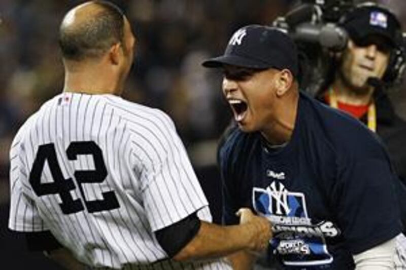 The New York Yankees' Mariano Rivera, left, and Alex Rodriguez celebrate.