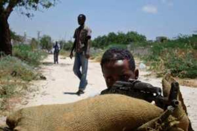 Islamist hardliners man a checkpoint in southern Mogadishu on March 3, 2009. The hardliners rejected Sunday a ceasefire offer which had been accepted by new President, Sheikh Sharif Sheikh Ahmed and vowed to keep up attacks on government forces AFP PHOTO/Mustafa ABDI .