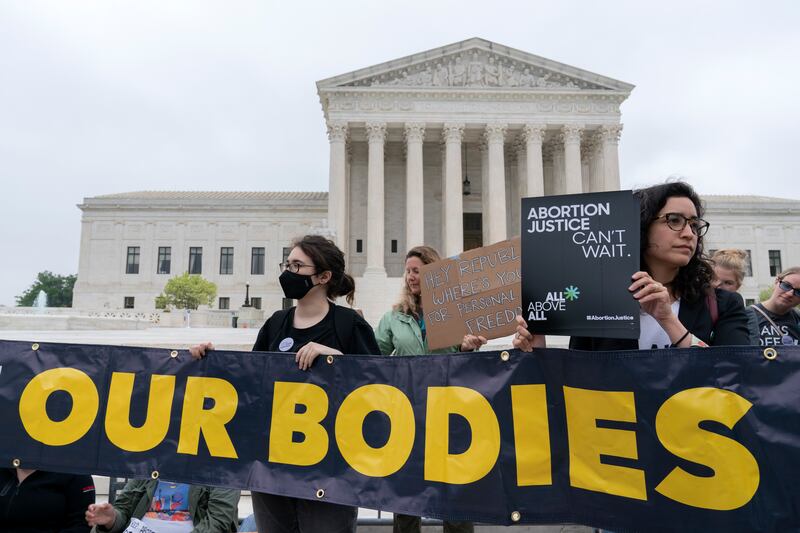 Demonstrators protest outside the US Supreme Court in Washington. AP