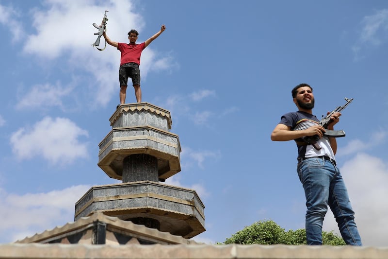 FILE PHOTO: Fighters loyal to Libya's internationally recognised government celebrate after regaining control over Tarhouna city, Libya, June 5, 2020. REUTERS/Ismail Zitouny/File Photo