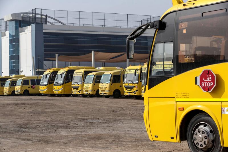 DUBAI, UNITED ARAB EMIRATES. 08 APRIL 2020. Unused school busses stand idle at the GEMS Wellington International School in al Sufouh. (Photo: Antonie Robertson/The National) Journalist: Standalone. Section: National.
