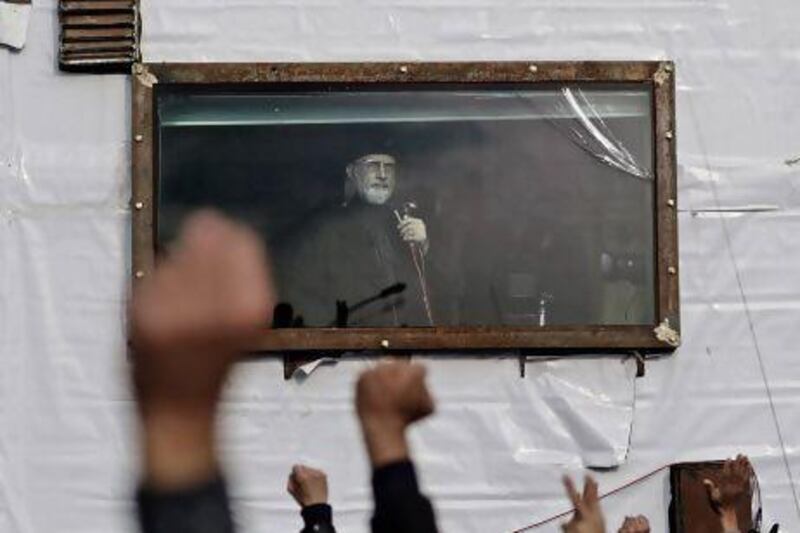 Pakistani Sunni cleric Tahir Ul Qadri addresses his supporters from a bullet-proof container during an anti-government rally in Islamabad.