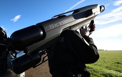 A French police officer holding a SkyWall Patrol anti-drone gun. Photo: OpenWorks