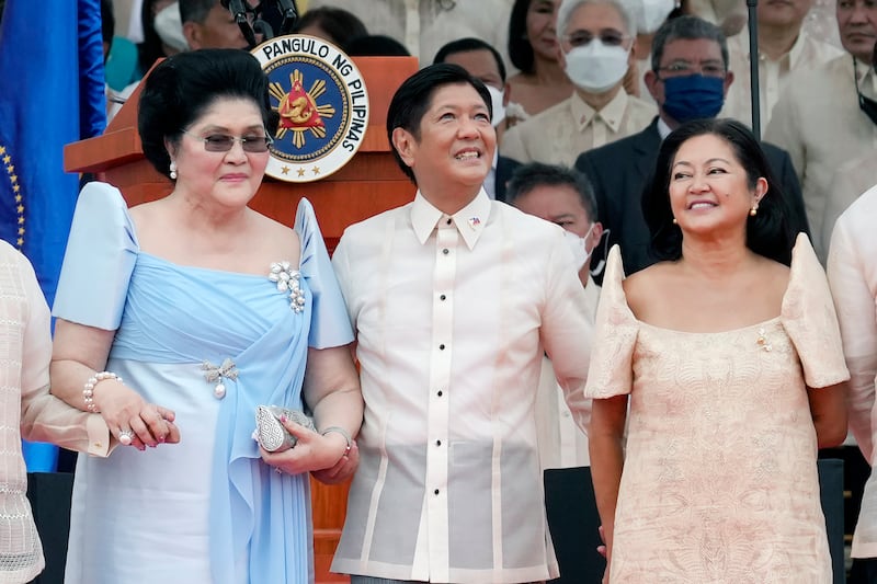 President Ferdinand Marcos Jr, centre,  stands with his mother Imelda Marcos, left, and his wife Maria Louise Marcos, right, during the presidential inauguration ceremony at National Museum on Thursday, June 30, 2022 in Manila, Philippines. Marcos was sworn in as the country's 17th president. AP Photo