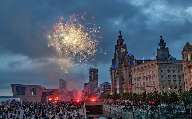 Fireworks go off outside the Liver Building in Liverpool. PA