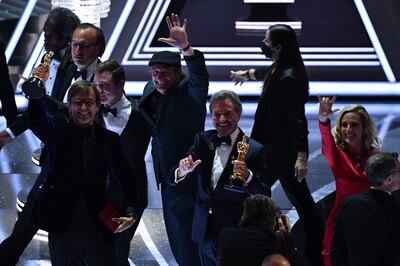 Stars of 'Coda' accept the Best Picture Award on stage at the Oscars. AFP