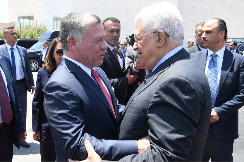 King Abdullah II of Jordan, left, is greeted by Palestinian President Mahmoud Abbas on his arrival in Ramallah, West Bank. PPO via Getty Images