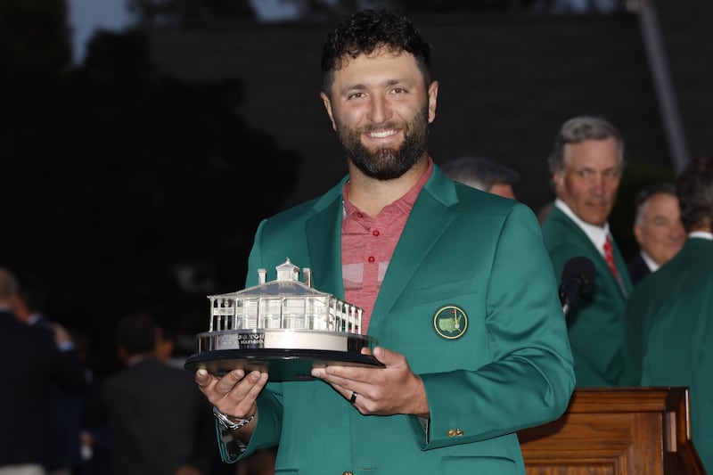 Jon Rahm holds the Masters trophy after winning at the Augusta National Golf Club. EPA