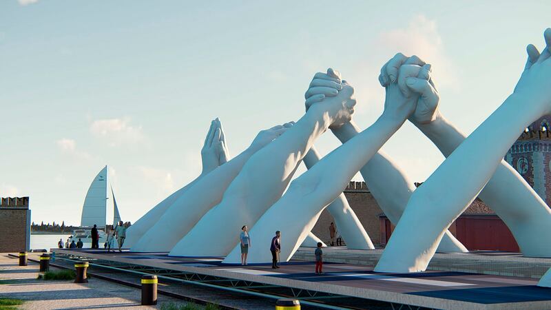 An artistic rendering of Lorenzo Quinn's six pairs of arching hands creating a bridge over a Venetian waterway. Italian artist Lorenzo Quinn created a splash on the sidelines of the Venice Biennale contemporary art fair two years ago with a sculpture of gigantic childâ€™s hands reaching out of the Grand Canal, calling attention to climate change that threatens, among other things, to sink the lagoon city. This edition, Quinn has created a successor sculpture that he wants to be a call to action: Six pairs of arching hands creating a bridge over a Venetian waterway, symbolic of the need overcome divisions. (BLJ via AP)