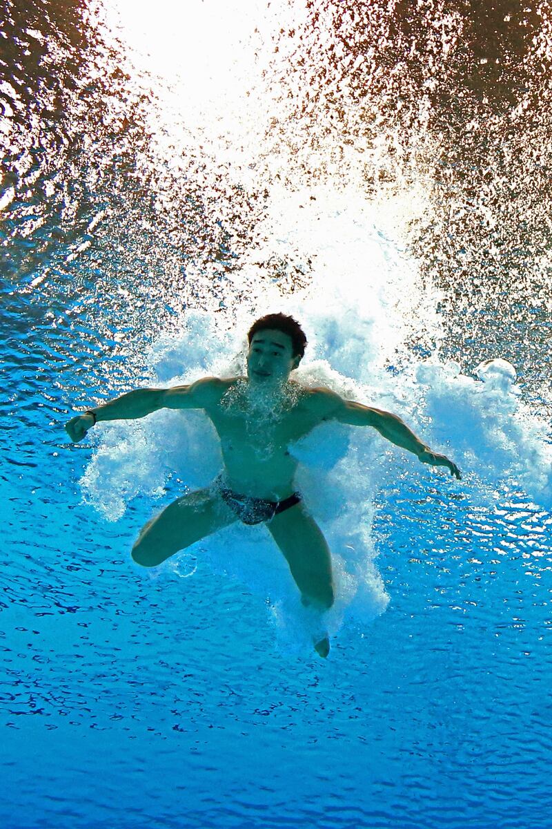 LONDON, ENGLAND - AUGUST 06:  Kai Qin of China competes in the Men's 3m Springboard Diving Preliminary on Day 10 of the London 2012 Olympic Games at the Aquatics Centre on August 6, 2012 in London, England.  (Photo by Clive Rose/Getty Images)