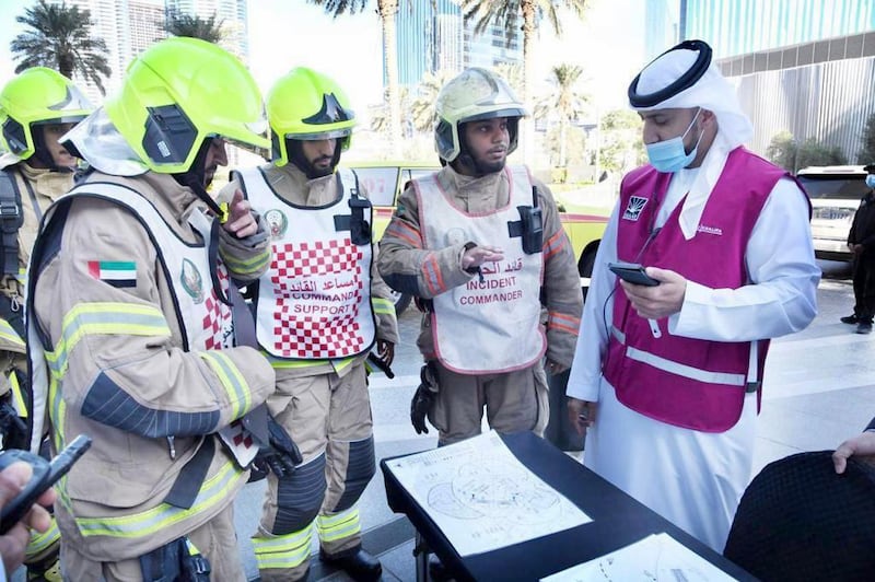 Dubai Civil Defence staff from Zabeel Centre discuss the evacuation plan.