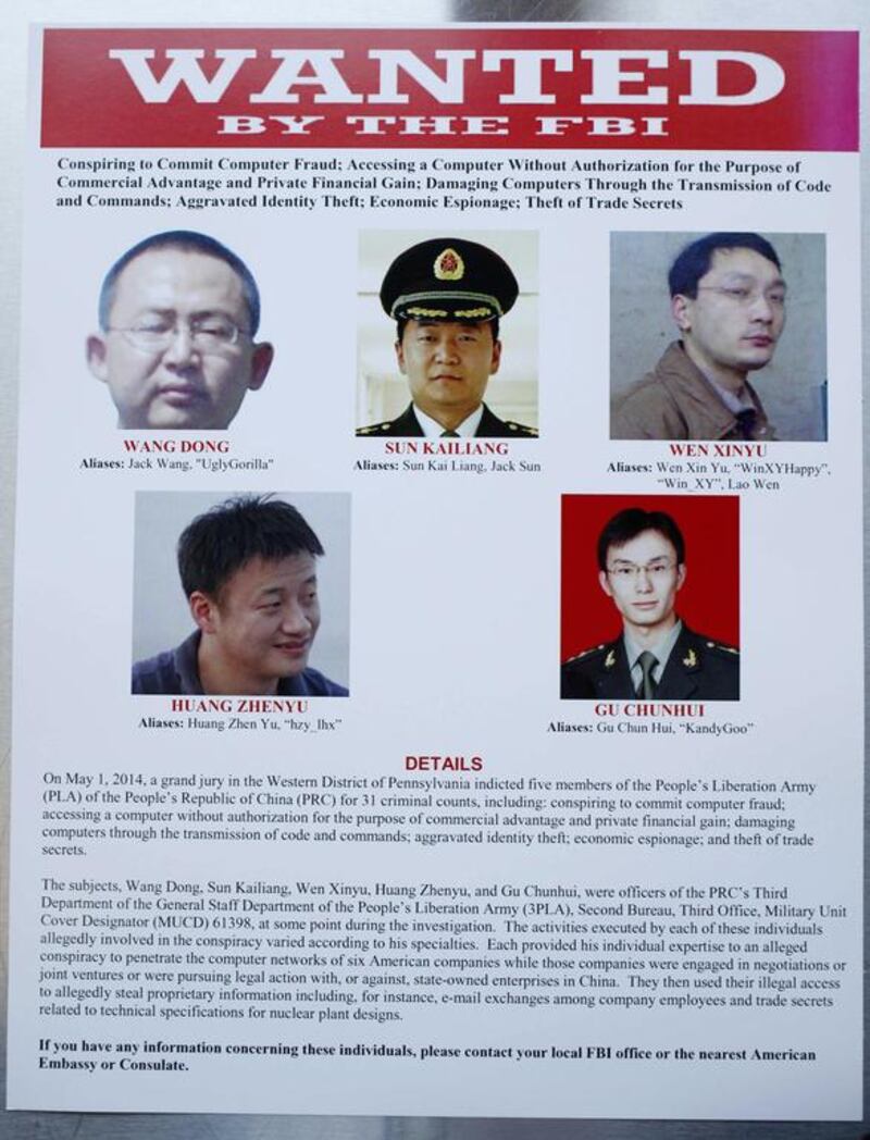 A 'wanted' poster displayed at the Justice Department in Washington on May 19, 2014, after a US jury charged five Chinese hackers with economic espionage and trade secret theft, the first-of-its-kind criminal charges against Chinese military officials in an international cyber-espionage case. AP Photo