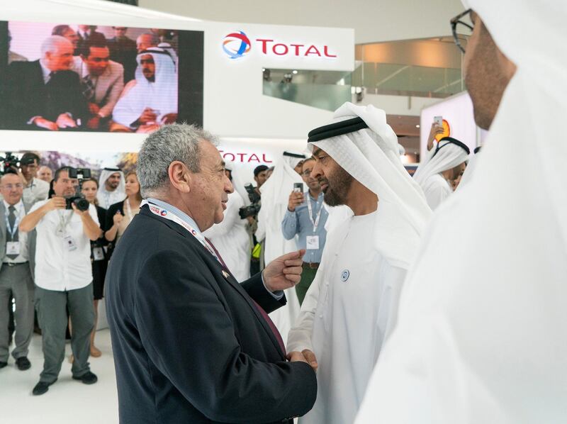 ABU DHABI, UNITED ARAB EMIRATES - November 14, 2018: HH Sheikh Mohamed bin Zayed Al Nahyan, Crown Prince of Abu Dhabi and Deputy Supreme Commander of the UAE Armed Forces (R), visits the TOTAL stand while touring the Abu Dhabi International Petroleum Exhibition and Conference (ADIPEC), at the Abu Dhabi National Exhibition Centre. 

( Rashed Al Mansoori / Ministry of Presidential Affairs )
---