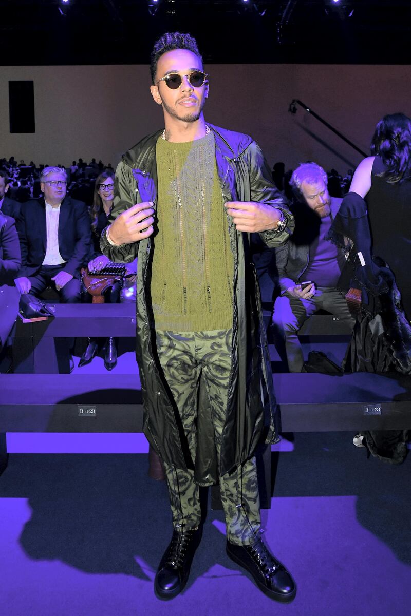 F1 driver Lewis Hamilton attends the show fashion house Versace during the Women's Fall/Winter 2017/2018 fashion week in Milan, on February 23, 2017. (Photo by Miguel MEDINA / AFP)