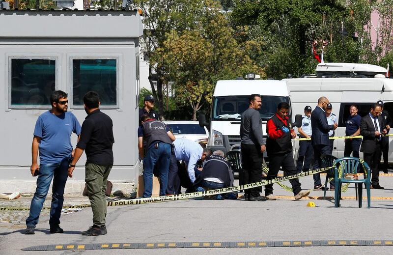 Police forensic experts examine in front of the Israeli embassy in Ankara on September 21, 2016. Umit Bektas / Reuters