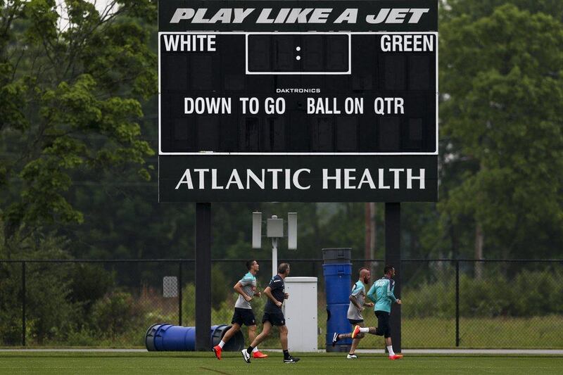 Portuguese national football team player Cristiano Ronaldo runs with physiotherapist Antonio Gaspar, second left, and teammates Raul Meireles, second right and Beto, right, during a training session on Tuesday at the New York Jets' centre in New Jersey, USA. Jose Sena Goulao / EPA / June 3, 2014