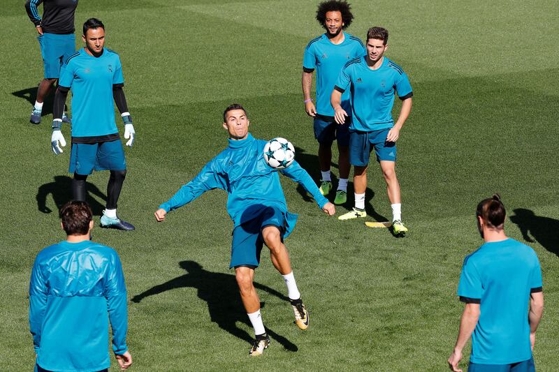 Cristiano Ronaldo, centre, controls the ball during training. Paul Hanna / Reuters