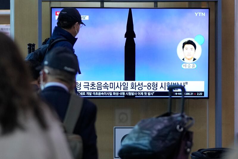 People at a train station in the South Korean capital Seoul watch on television North Korea's missile launch, on September  29, 2021. AP Photo
