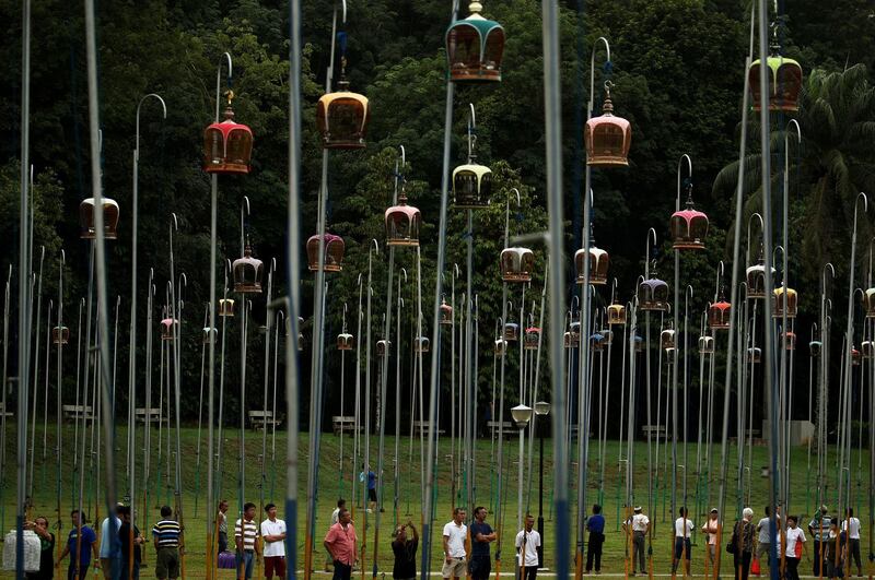 Participants and bird owners wait for the start of the merbok (zebra dove) bird singing competition at the Kebun Baru Birdsinging Club in Singapore. Reuters