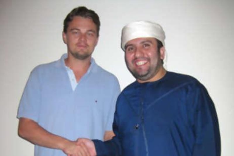 Thsi handout picture shows Leonardo DiCaprio, and Dr. Sulaiman Al Fahim, CEO Hydra Properties and head of Abu Dhabi United Group and Man City's Pairoj Piempongsant (right). Abu Dhabi United Group says it has bought the Manchester City football club from Thaksin Shinawatra and signed the deal at the Emirates Palace Hotel in Abu Dhabi on Sunday night.?
