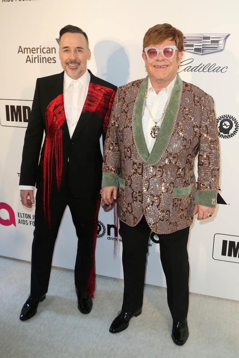 David Furnish and Elton John arrive at the singer's own 2019 Elton John AIDS Foundation Oscar Viewing Party on Sunday, February 24, 2019. AP
