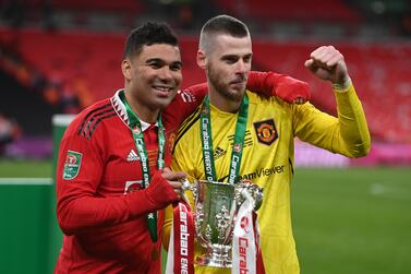 Manchester United's Casemiro (L) and goalkeeper David De Gea celebrate after winning the Carabao Cup final soccer match between Manchester United and Newcastle United, in London, Britain, 26 February 2023.   EPA / NEIL HALL