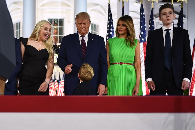 First lady Melania Trump (2nd R), Barron Trump (R) and Tiffany Trump look on as US President Donald Trump gives a thumbs up to grandson Theodore James Kushner after he delivered his acceptance speech. AFP