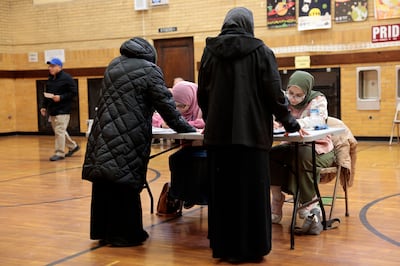 Voters check in at a polling booth in Dearborn, Michigan. AFP