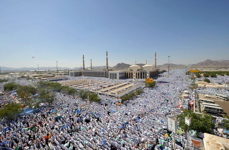 Muslim Hajj pilgrims perform the noon prayers at the Nemra mosque near Mount Arafat on November 5, 2011. More than two million Muslims began massing on Saudi Arabia's Mount Arafat and its surrounding plain, marking the peak day of the largest annual pilgrimage. AFP PHOTO/FAYEZ NURELDINE
 *** Local Caption ***  206542-01-08.jpg