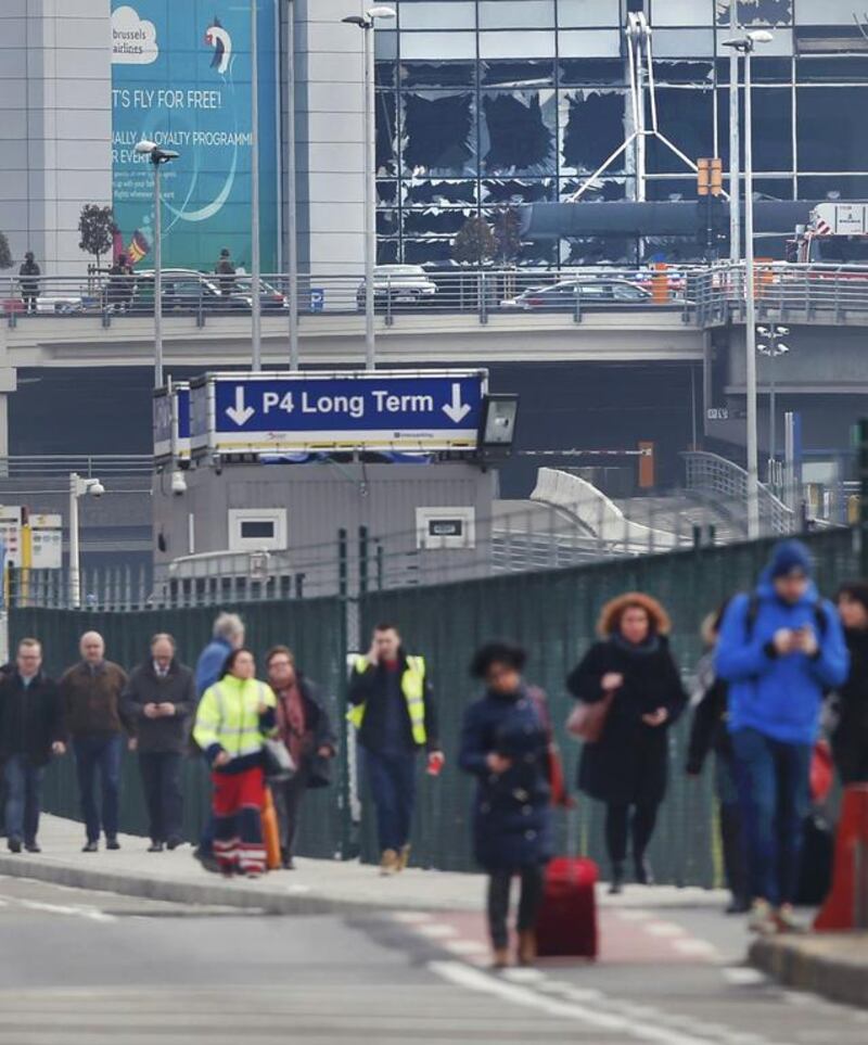 People leave the scene of explosions at Zaventem airport near Brussels, Belgium. Francois Lenoir / Reuters