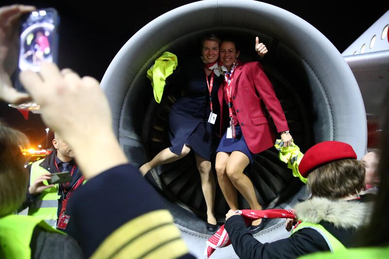 Airport staff members pose for a picture next to the AB6210, the last flight, operated by insolvent carrier Air Berlin before departing Munich's international airport, southern Germany. Michael Dalder  / Reuters